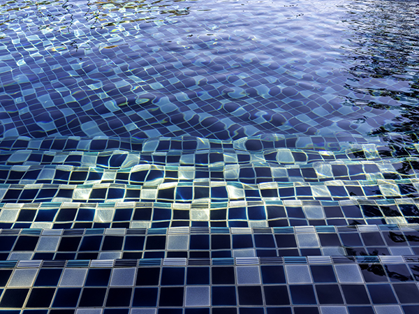 Swimming pool steps with clear water surface background, nobody.